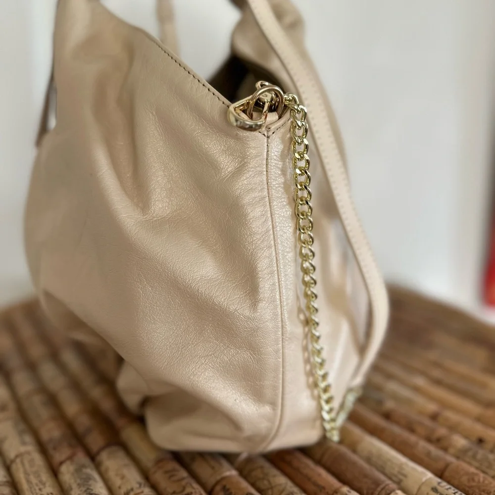 NWT gorgeous gold leather handbag. Detachable shoulder strap. Gold and beige